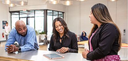 three people in a meeting