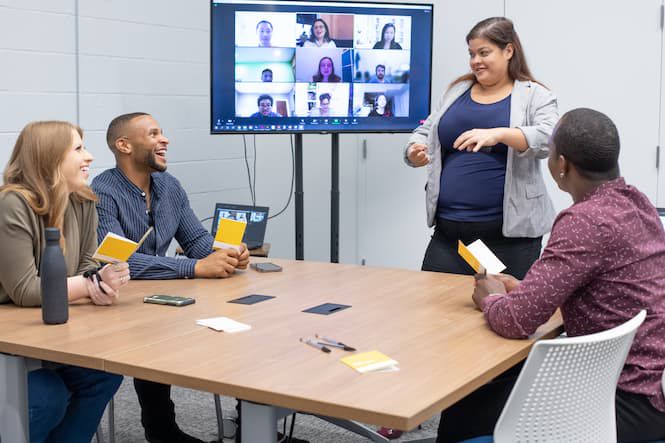 four people in conversation