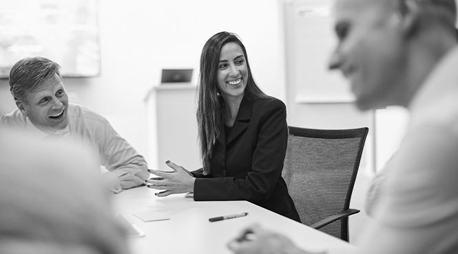 three people in a meeting