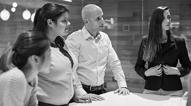 4 people around conference table